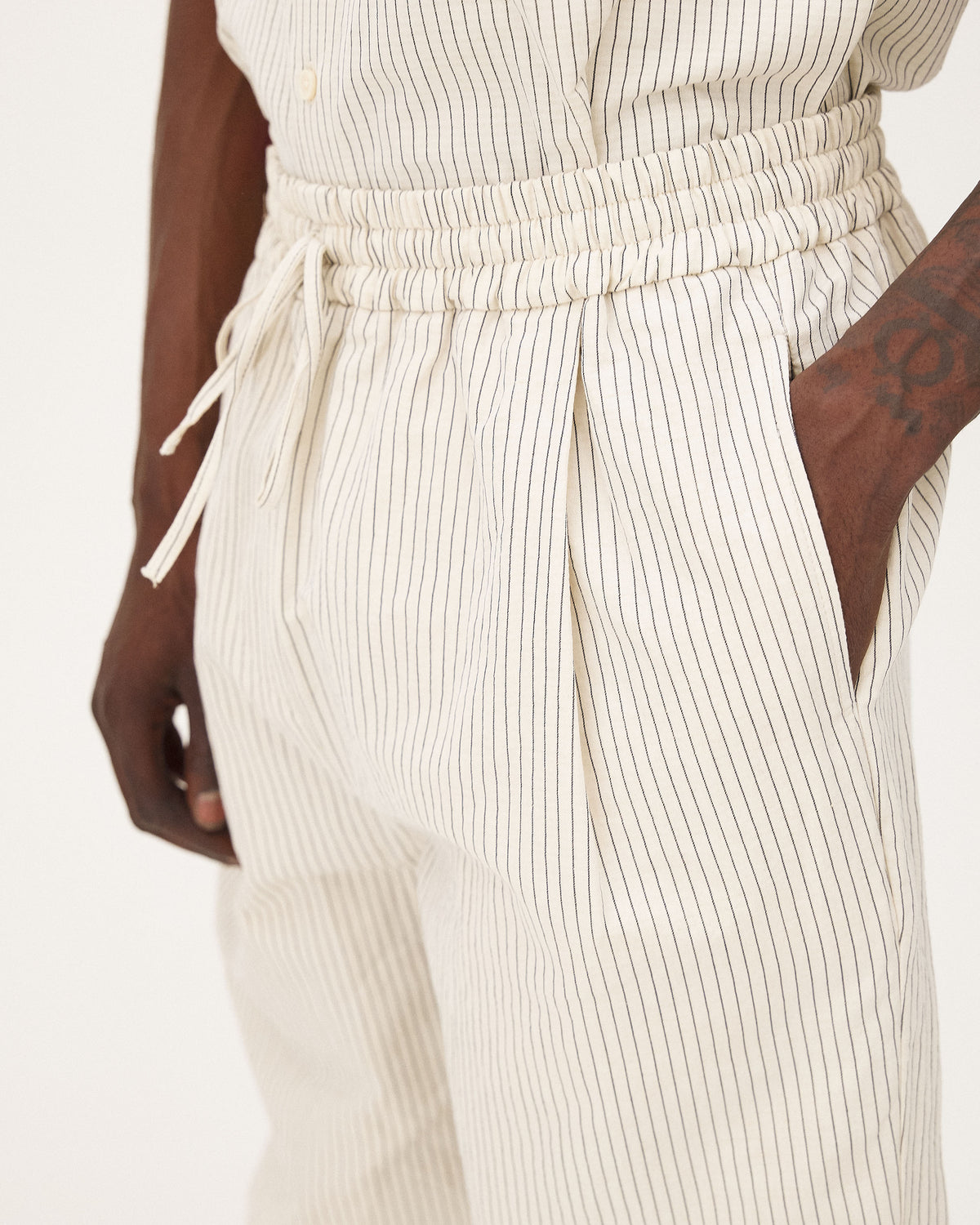 Helio Ecru Stripes pants, SS26 studio detail view